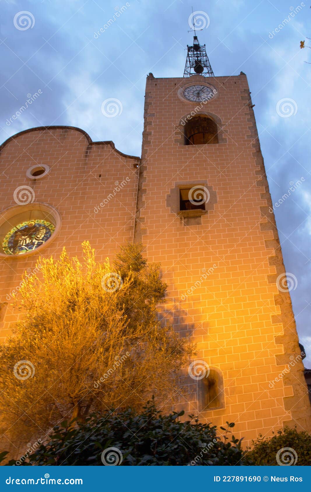 the bell tower illuminated in the evening